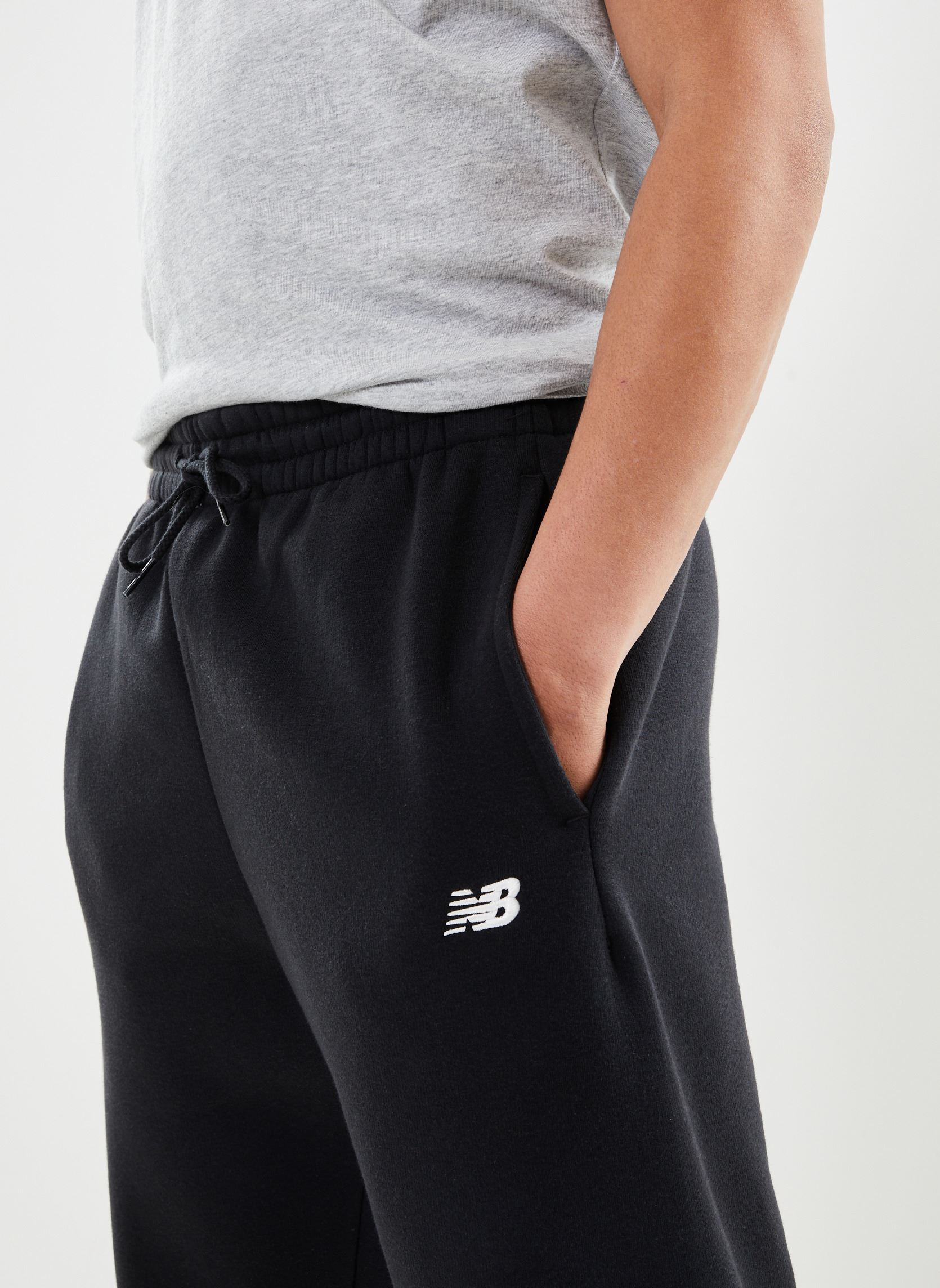 Bas de jogging Sport Essentials Fleece Jogger homme noir New Balance Bas de jogging Sport Essentials Fleece Jogger homme noir BLACK