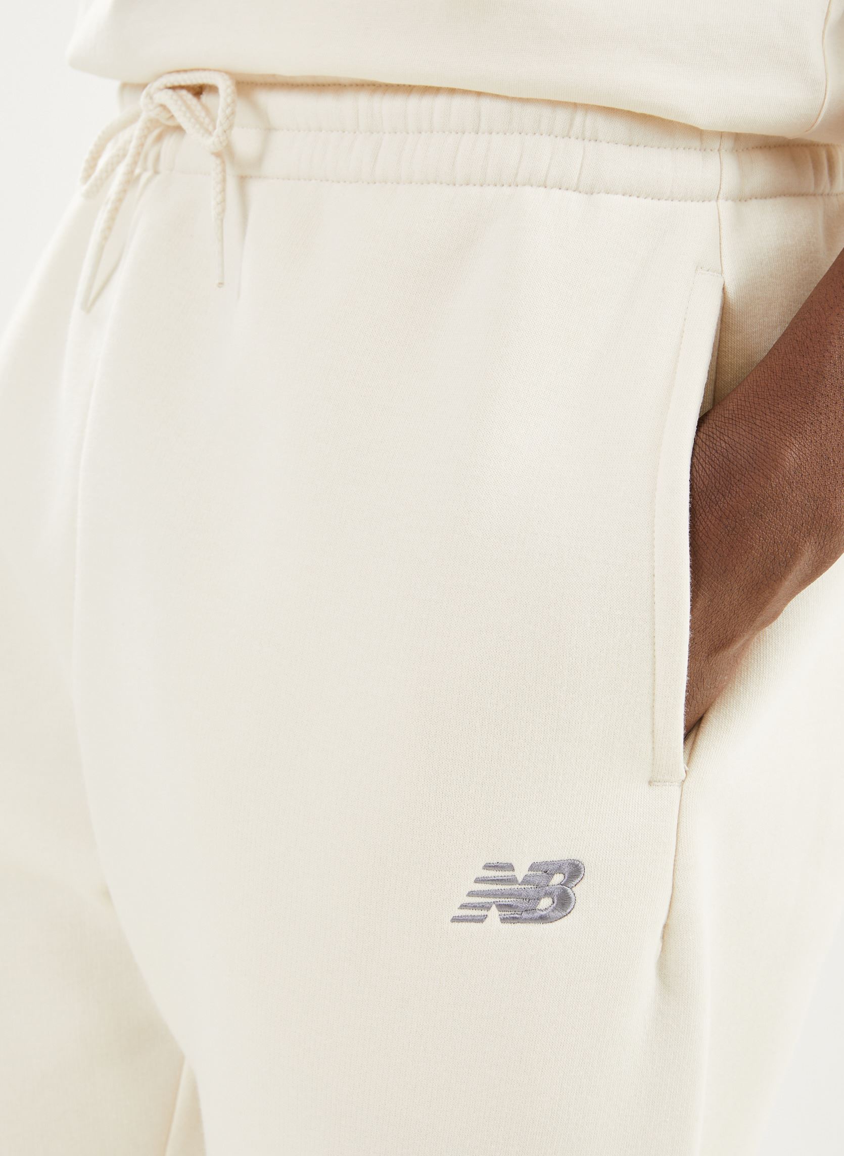 Bas de jogging Sport Essentials Fleece Jogger homme blanc New Balance Bas de jogging Sport Essentials Fleece Jogger homme blanc Linen