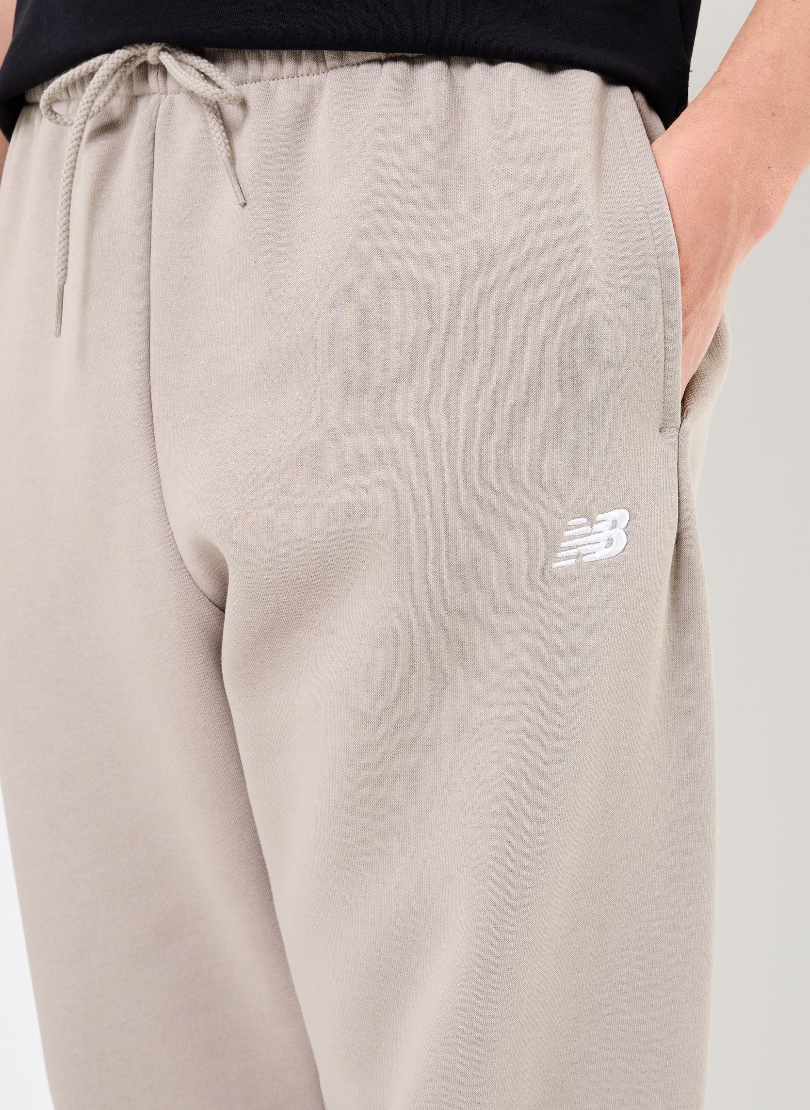 Bas de jogging Sport Essentials Fleece Jogger homme beige New Balance Bas de jogging Sport Essentials Fleece Jogger homme beige Arid Stone