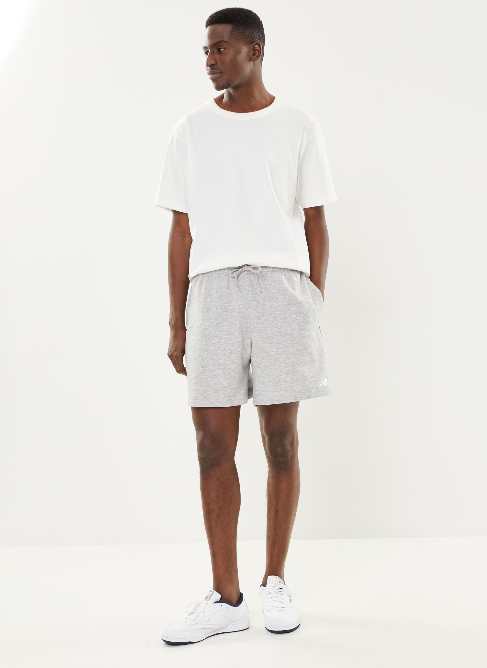 Shorts de sport Sport Essentials French Terry Short 7 homme gris New Balance Shorts de sport Sport Essentials French Terry Short 7 homme gris ATHLETIC GREY
