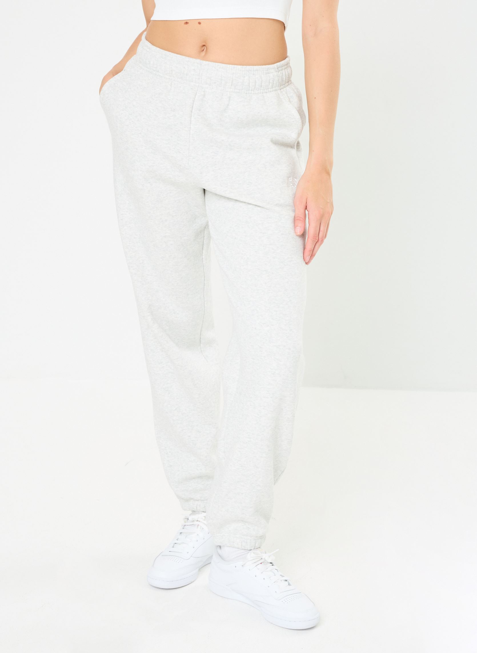Bas de jogging Sport Essentials Fleece Jogger NPU femme gris New Balance Bas de jogging Sport Essentials Fleece Jogger NPU femme gris ASH HEATHER