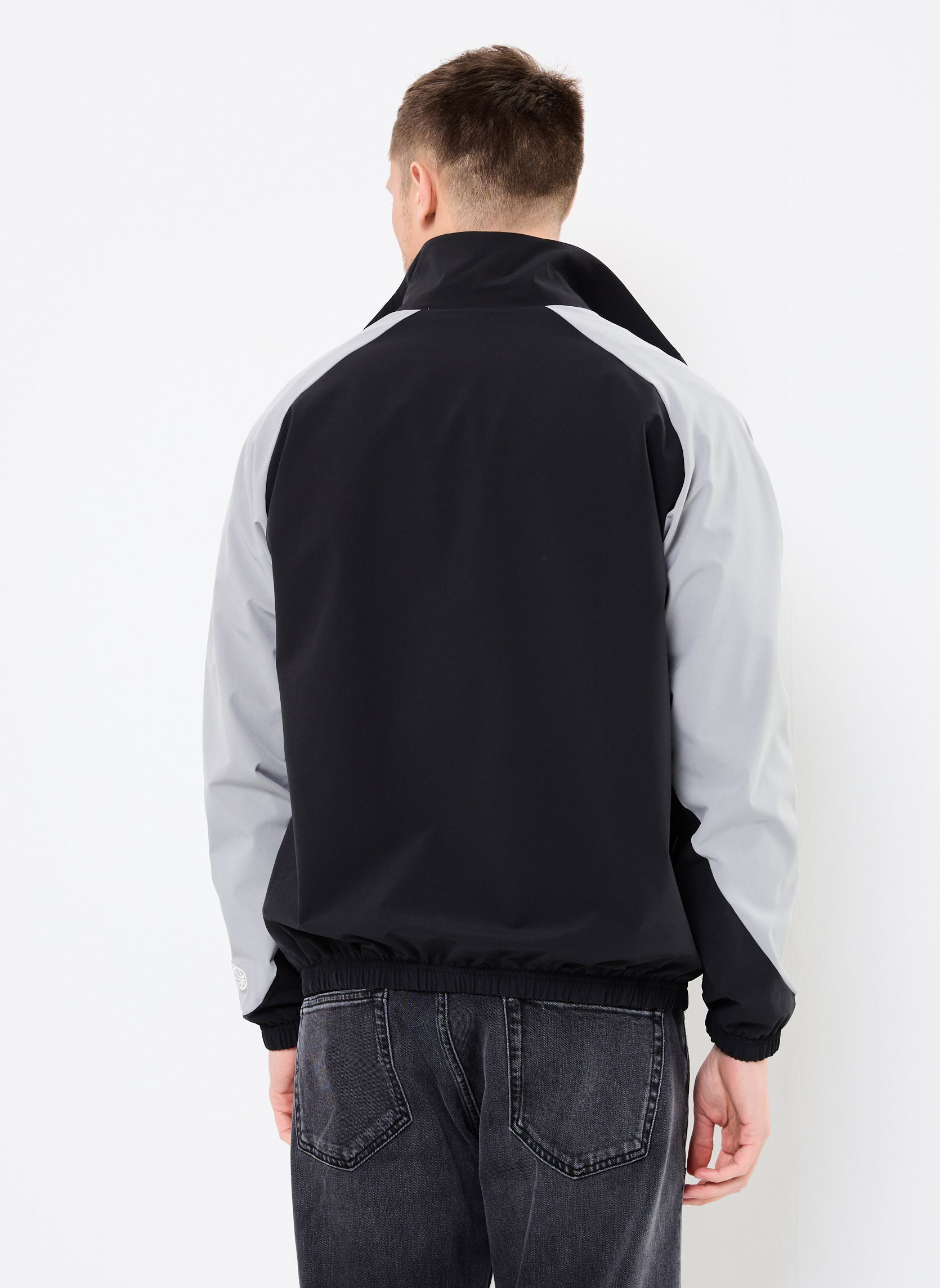 Blousons Woven Track Jacket homme noir New Balance Blousons Woven Track Jacket homme noir Black