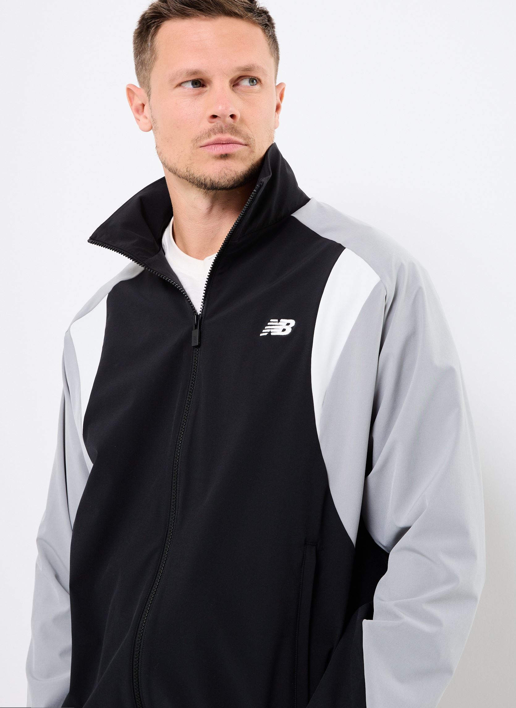 Blousons Woven Track Jacket homme noir New Balance Blousons Woven Track Jacket homme noir Black