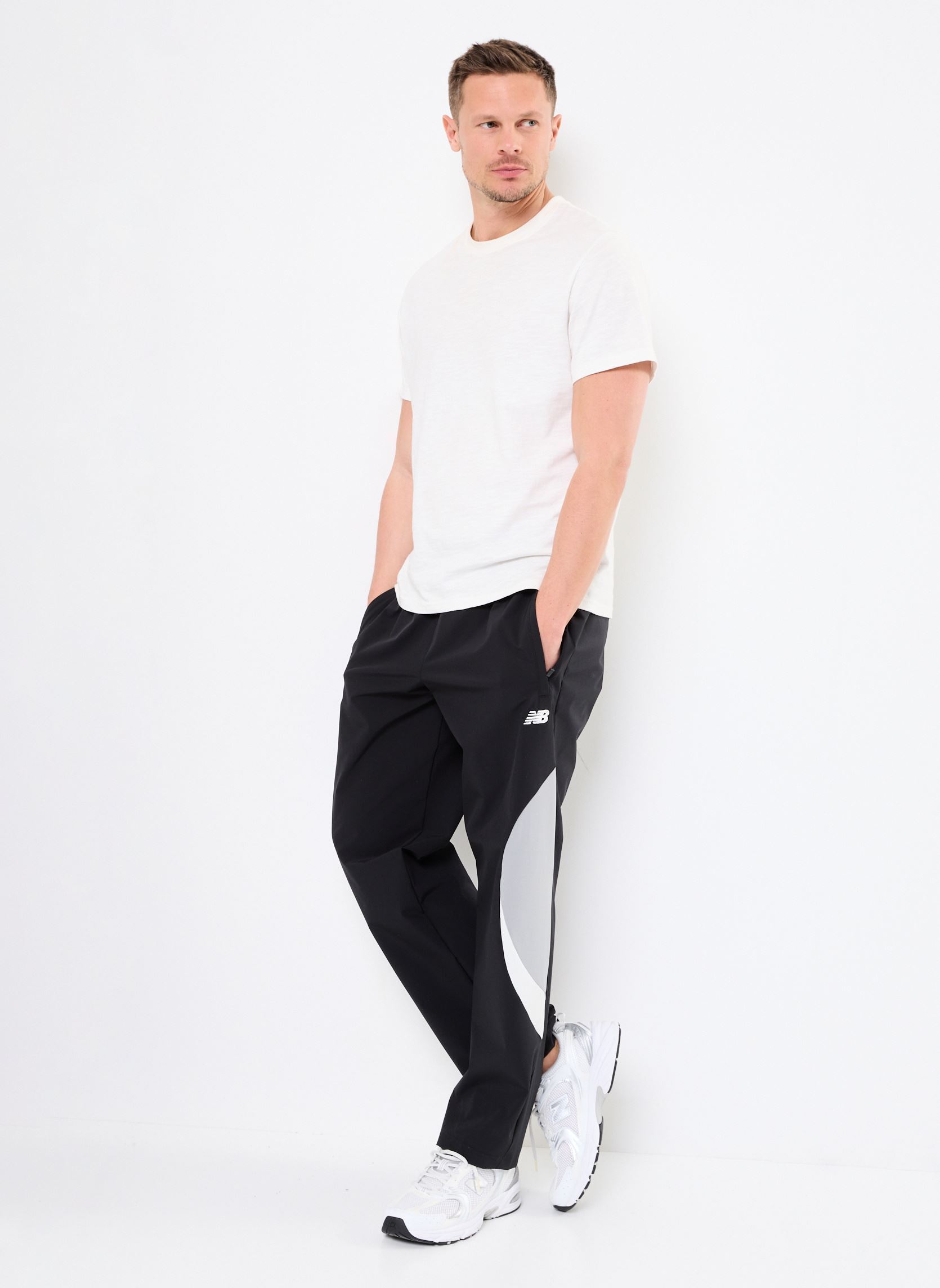 Joggings Woven Track Pant homme noir New Balance Joggings Woven Track Pant homme noir Black