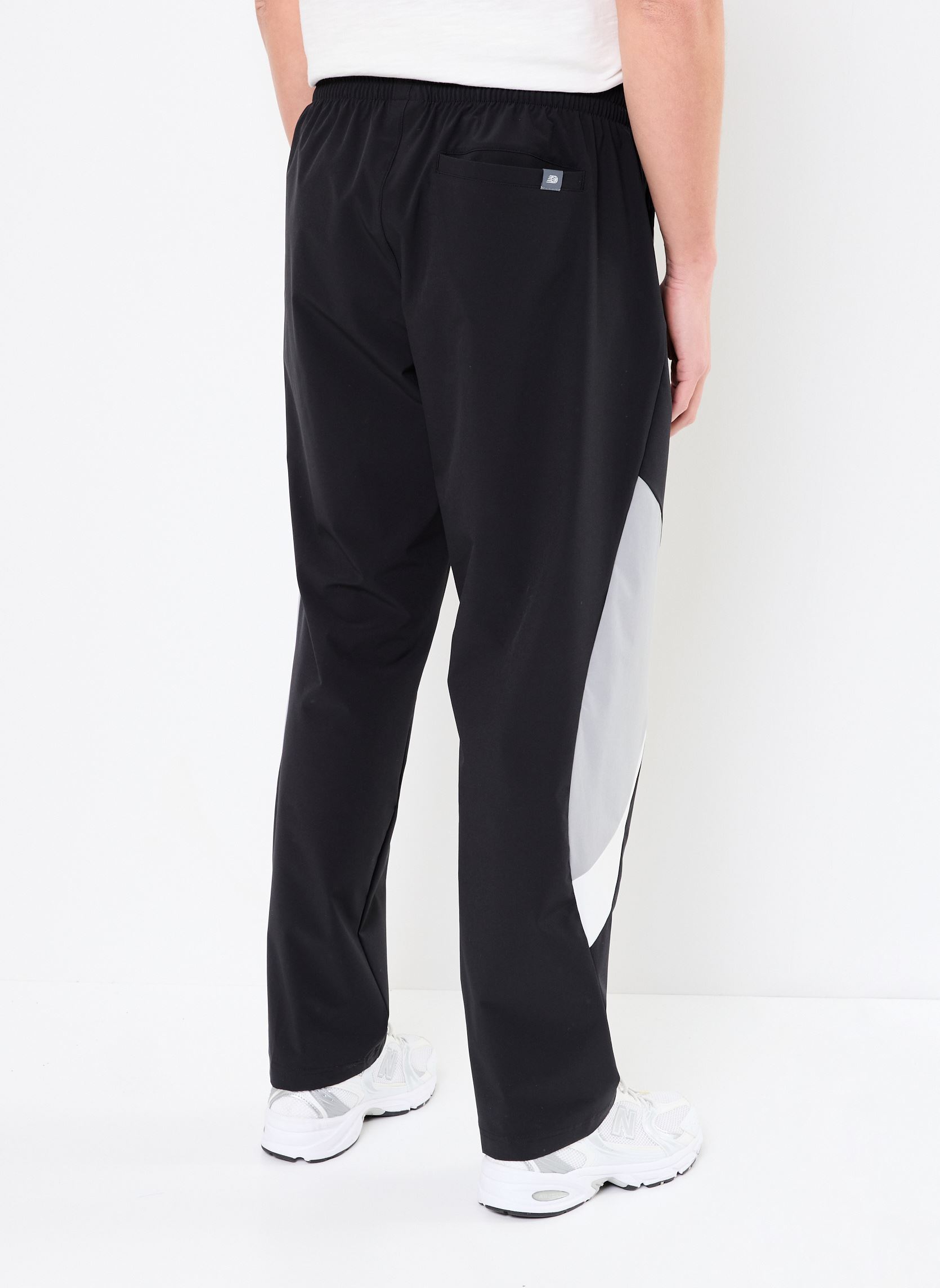 Joggings Woven Track Pant homme noir New Balance Joggings Woven Track Pant homme noir Black