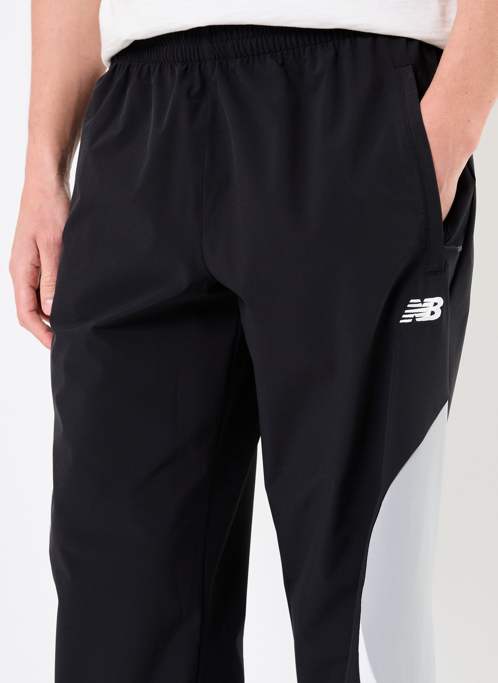 Joggings Woven Track Pant homme noir New Balance Joggings Woven Track Pant homme noir Black