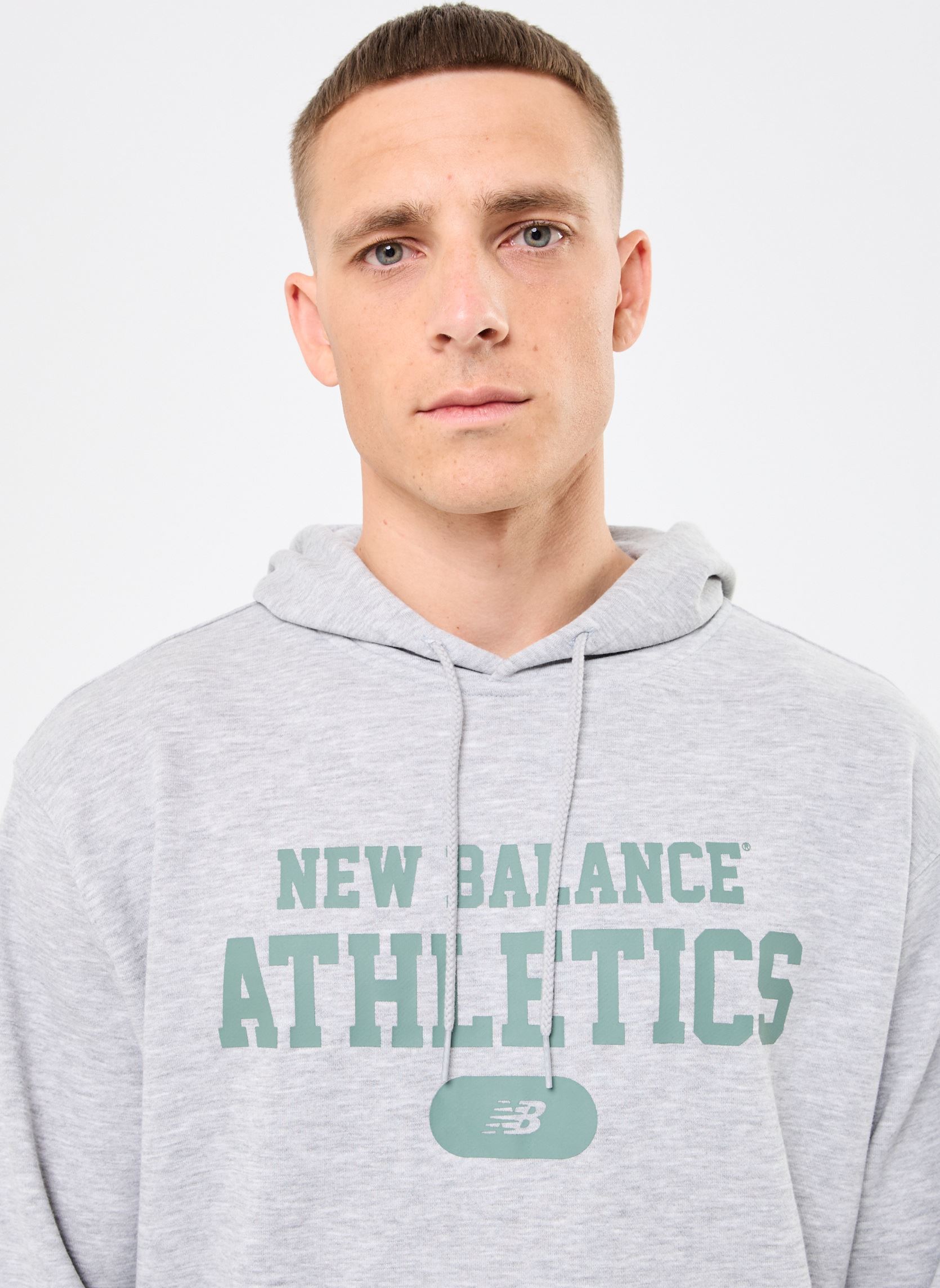 Sweats à capuche Heritage French Terry Graphic Hoodie homme gris New Balance Sweats à capuche Heritage French Terry Graphic Hoodie homme gris ATHLETIC GREY