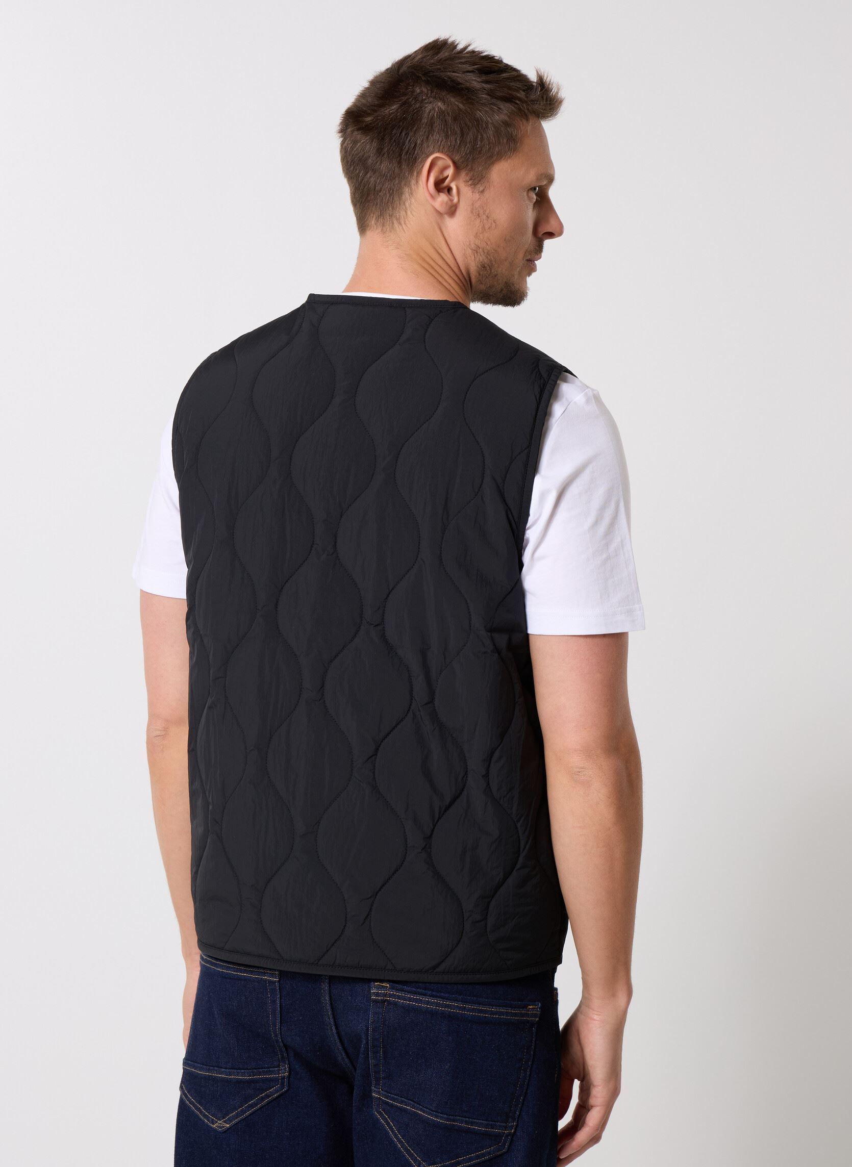 Giacche TJM QUILTED VEST EXT uomo nero Tommy Jeans Giacche TJM QUILTED VEST EXT uomo nero BLACK