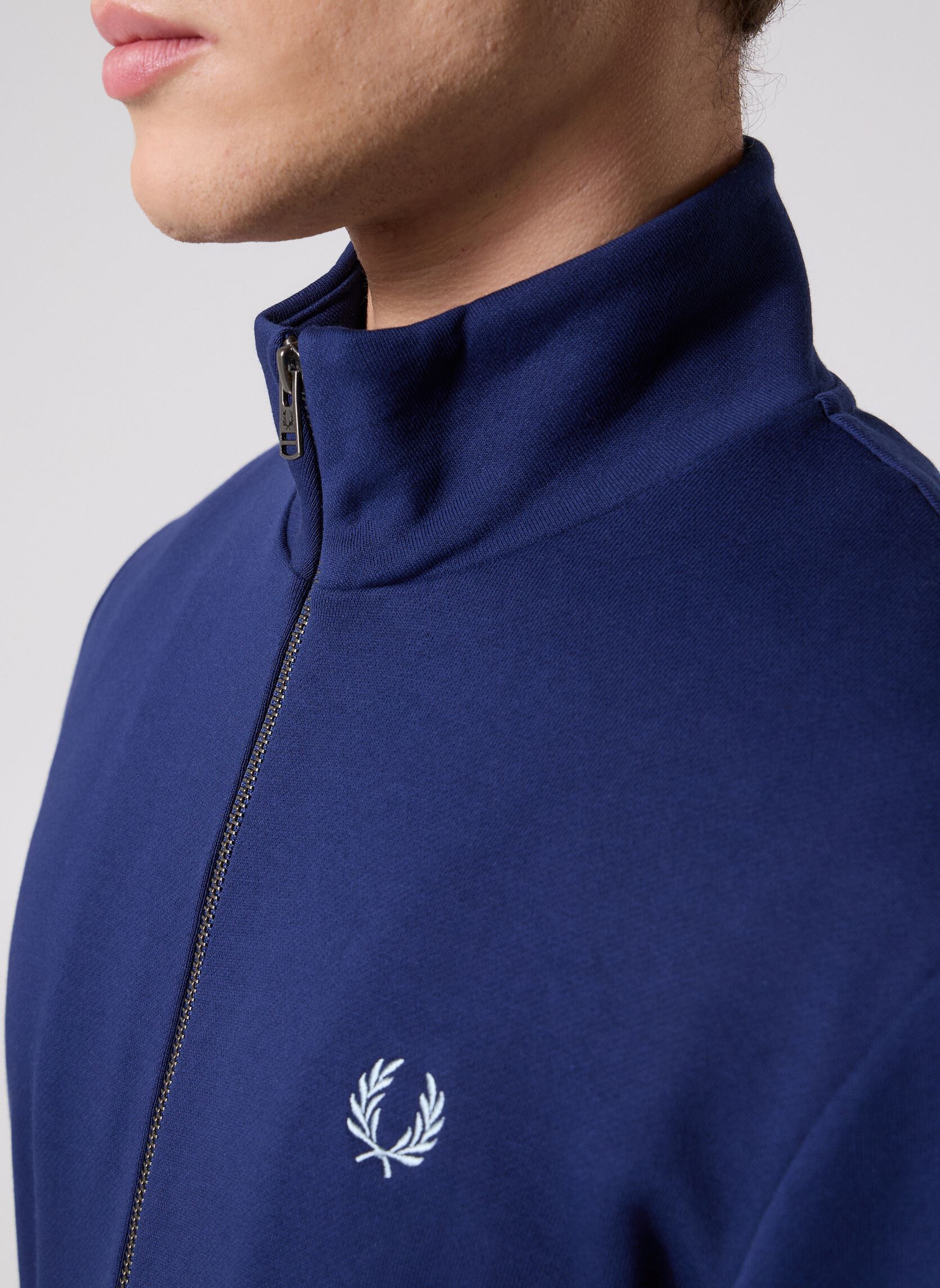 Fred Perry - Pull avec empiècement à carreaux écossais - Noir | ASOS
