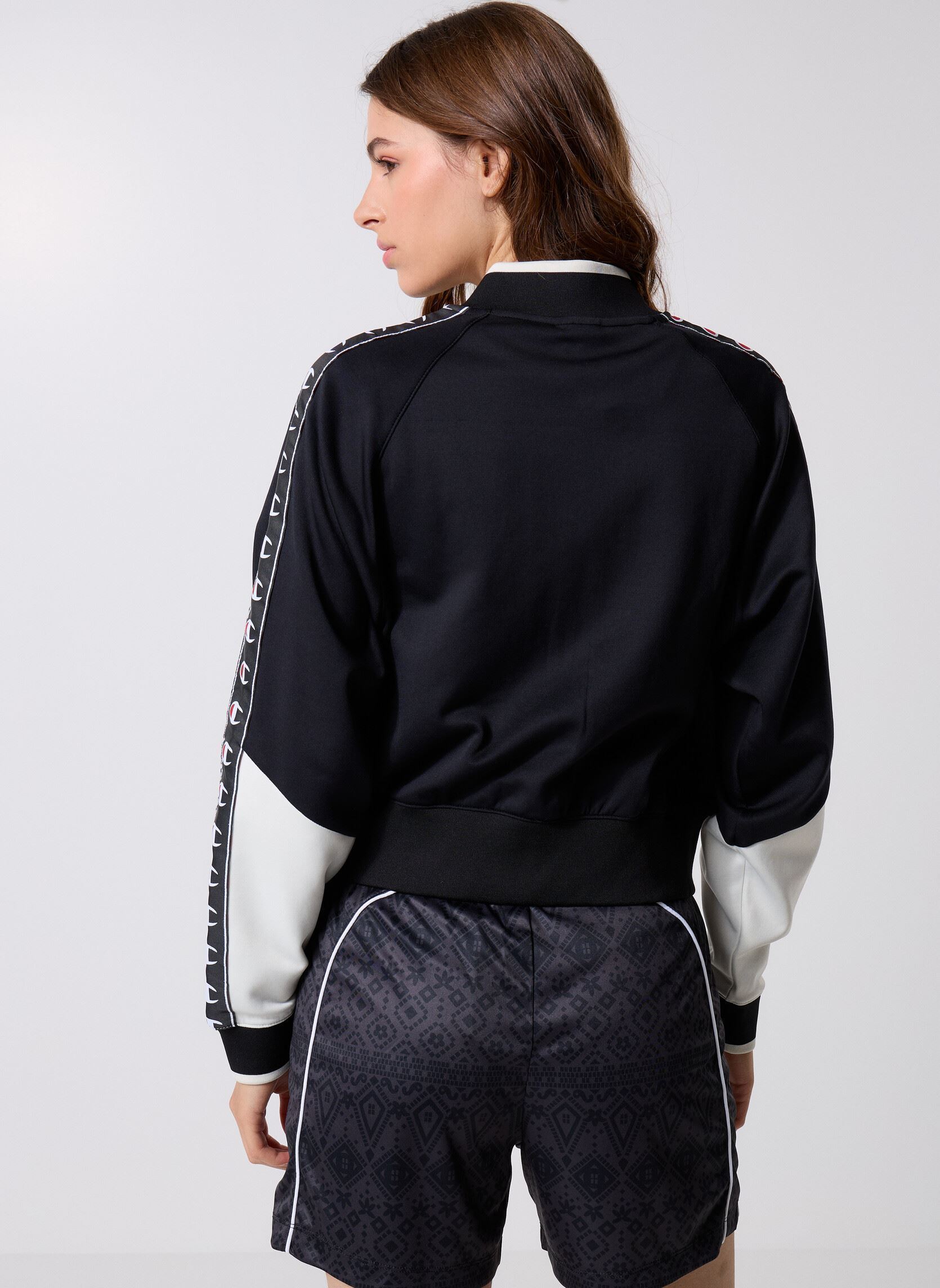 Vestes de survêtement 118373 femme noir Champion Vestes de survêtement 118373 femme noir KK001