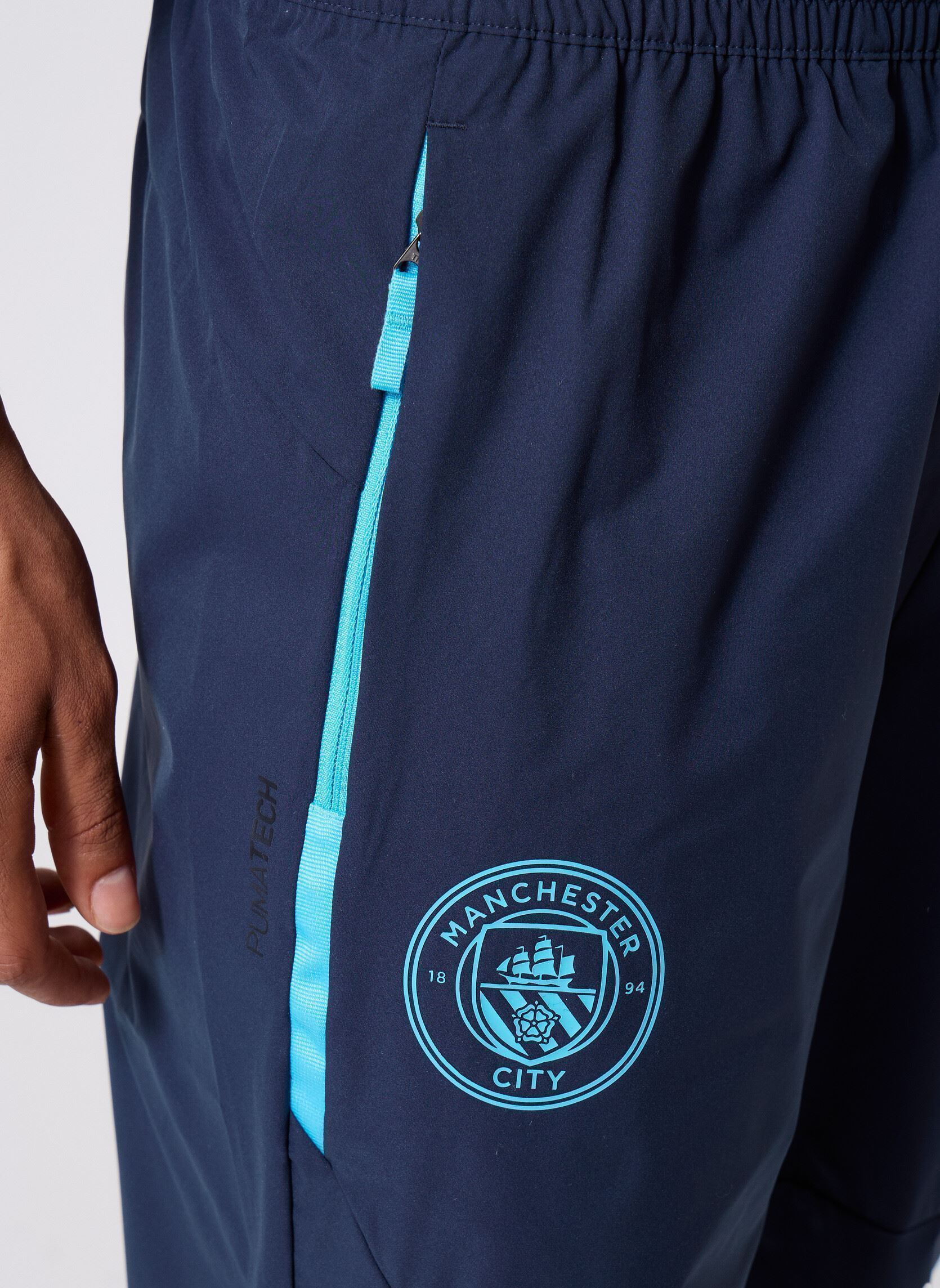 Joggingbroeken Mcfc Pumatech Woven Pants heren blauw Puma Joggingbroeken Mcfc Pumatech Woven Pants heren blauw Deep Navy-Team L