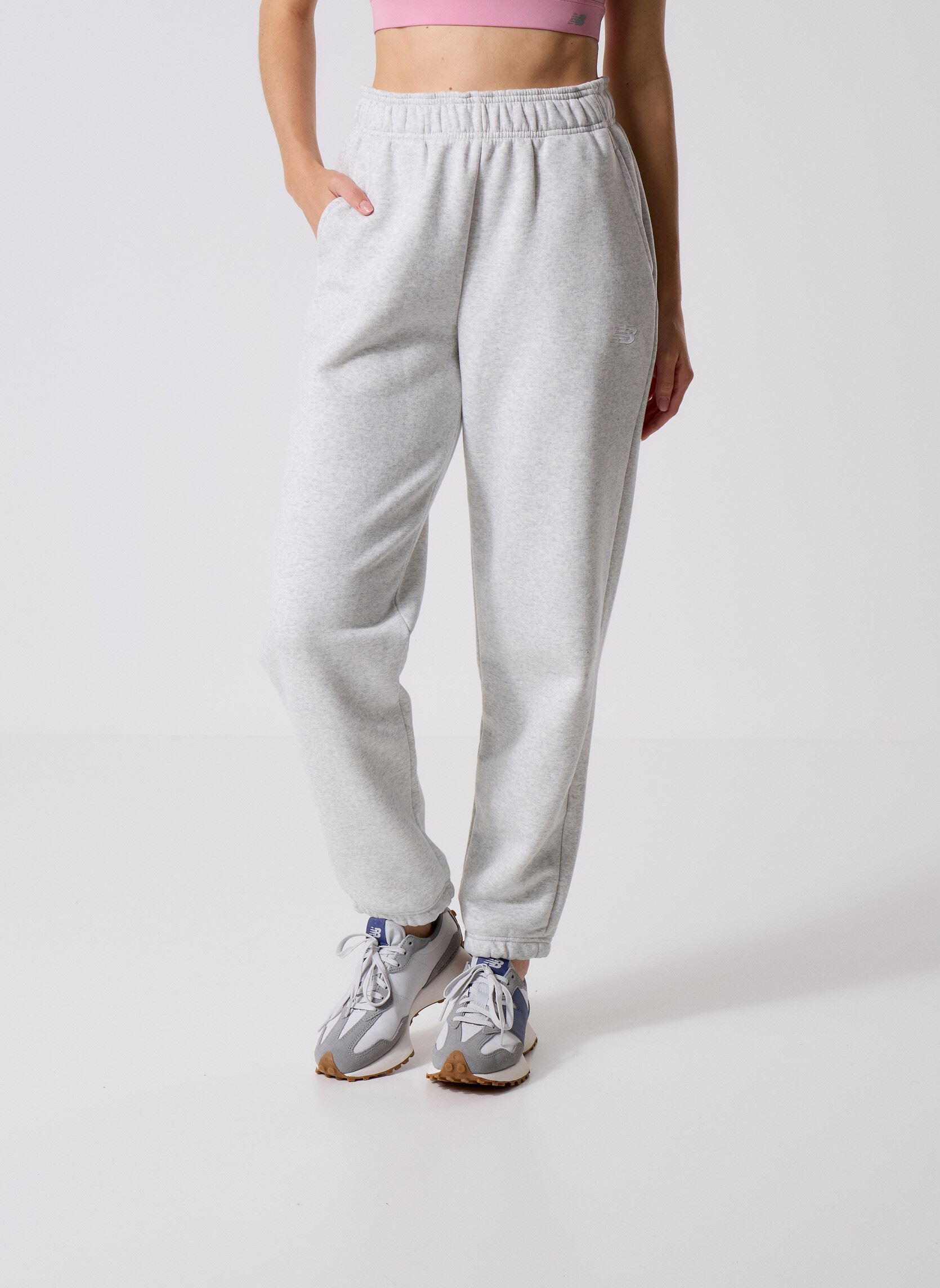 Bas de jogging Sport Essentials Fleece Jogger Women femme gris New Balance Bas de jogging Sport Essentials Fleece Jogger Women femme gris ASH HEATHER
