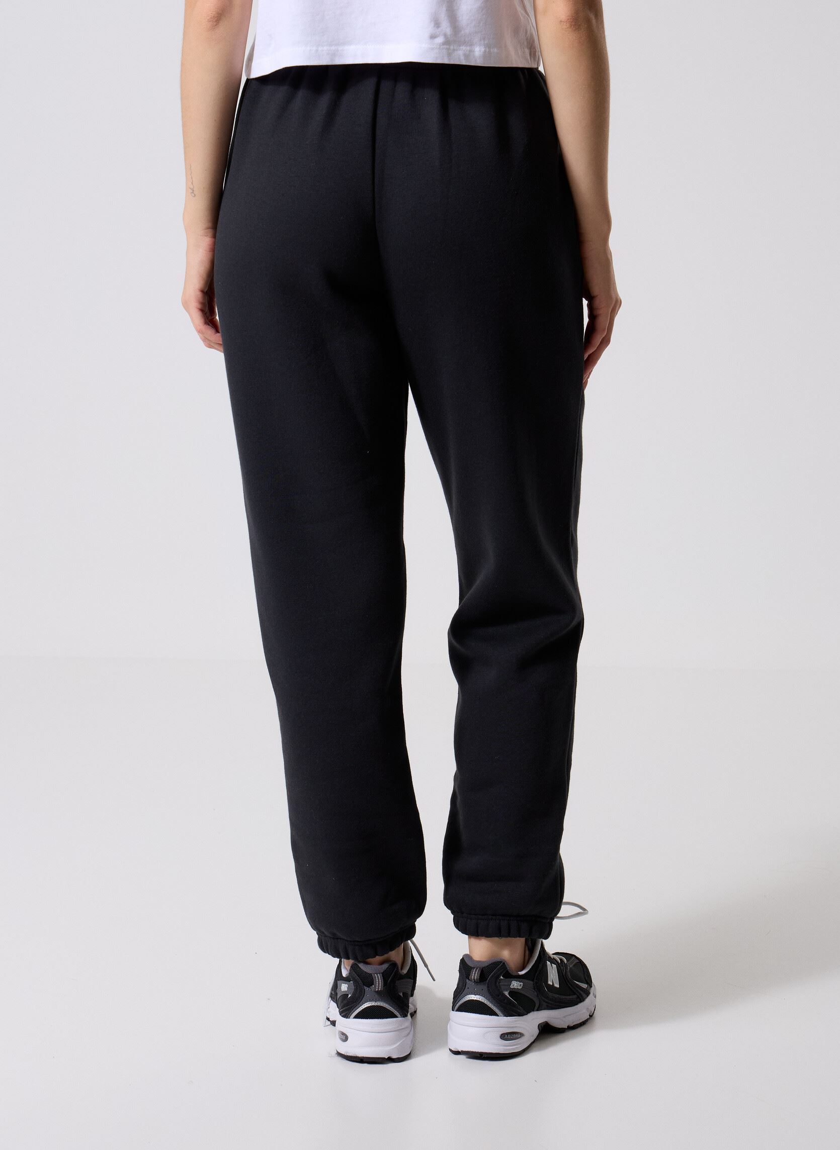 Bas de jogging Sport Essentials Fleece Jogger Women femme noir New Balance Bas de jogging Sport Essentials Fleece Jogger Women femme noir BLACK