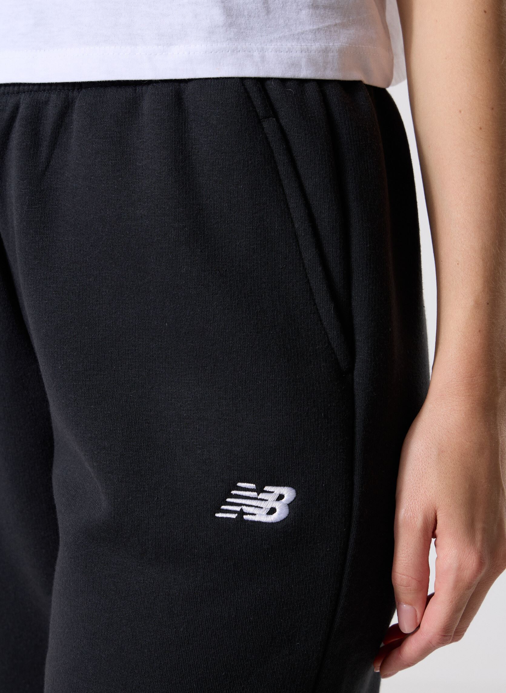 Bas de jogging Sport Essentials Fleece Jogger Women femme noir New Balance Bas de jogging Sport Essentials Fleece Jogger Women femme noir BLACK