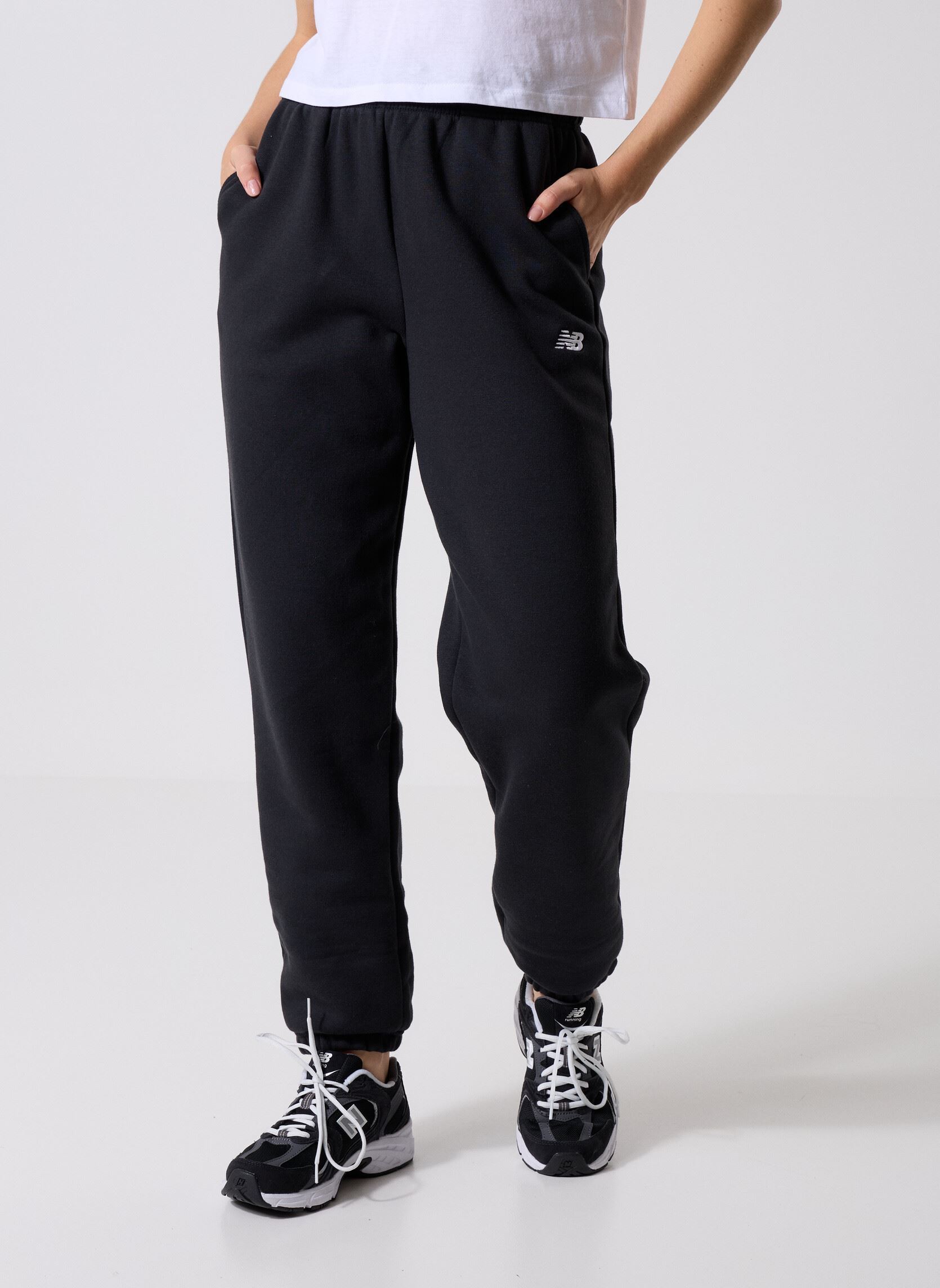 Bas de jogging Sport Essentials Fleece Jogger Women femme noir New Balance Bas de jogging Sport Essentials Fleece Jogger Women femme noir BLACK