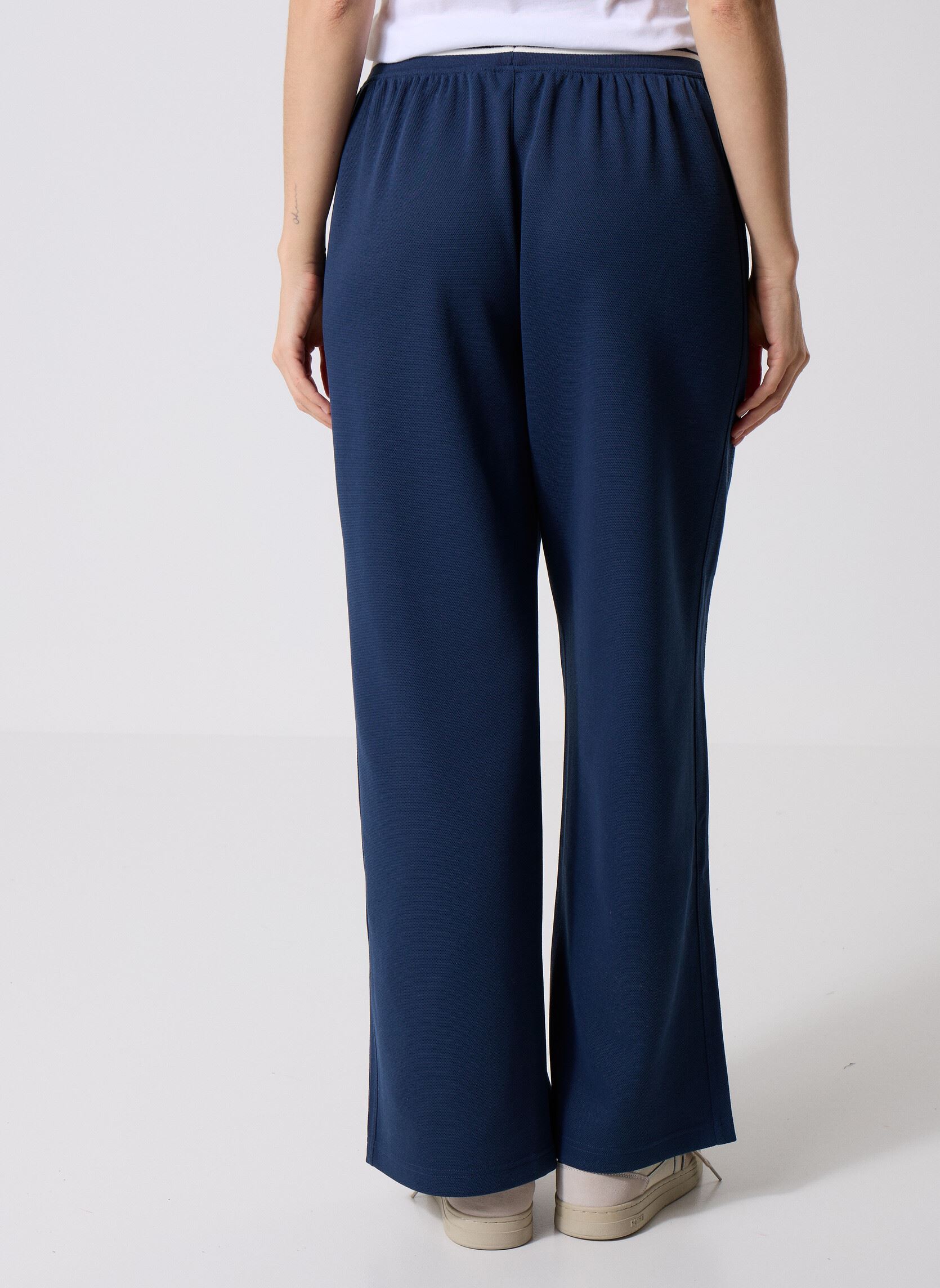 Bas de jogging Post Season Pique Track Pant femme bleu New Balance Bas de jogging Post Season Pique Track Pant femme bleu NB NAVY