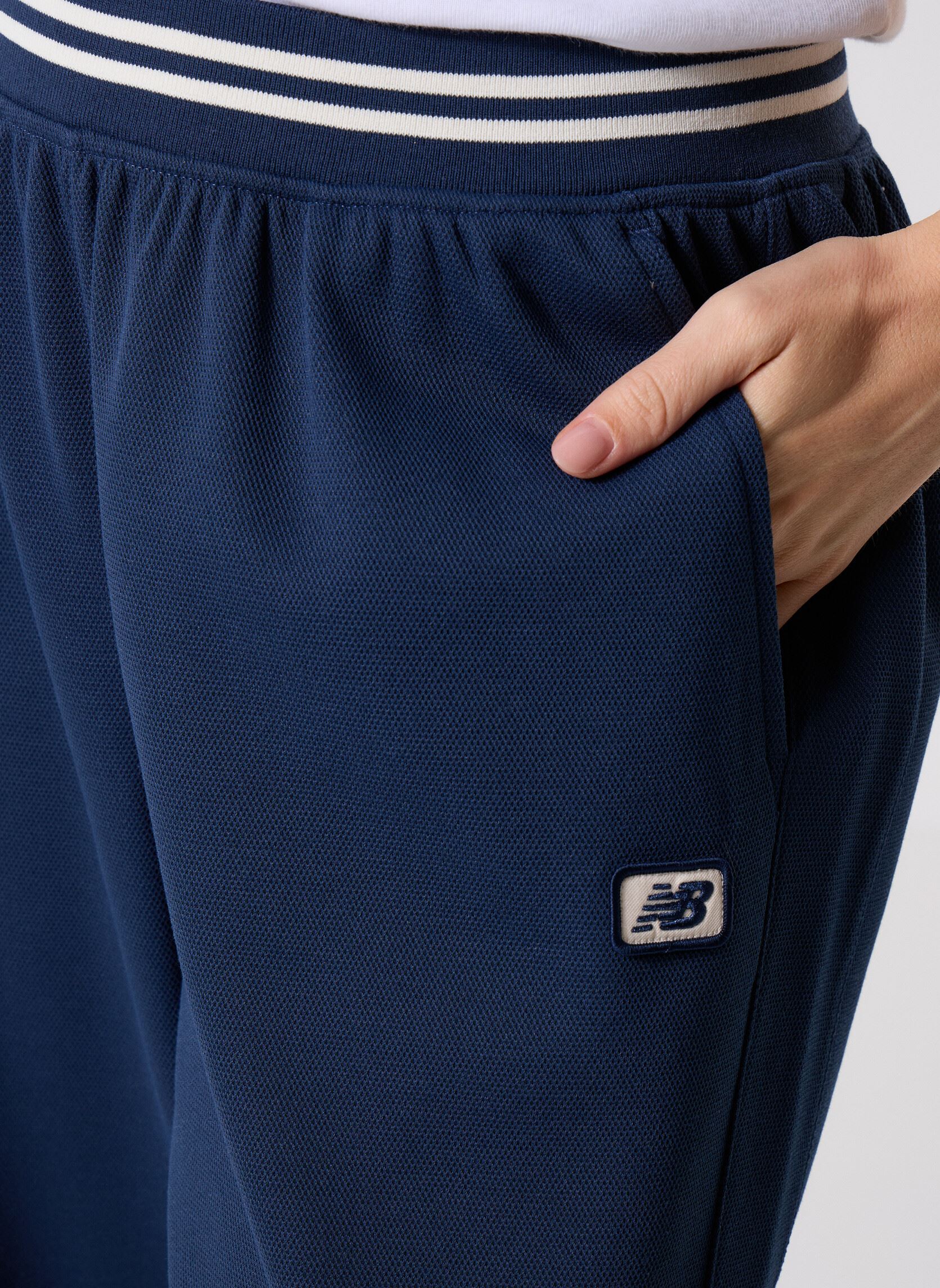 Bas de jogging Post Season Pique Track Pant femme bleu New Balance Bas de jogging Post Season Pique Track Pant femme bleu NB NAVY