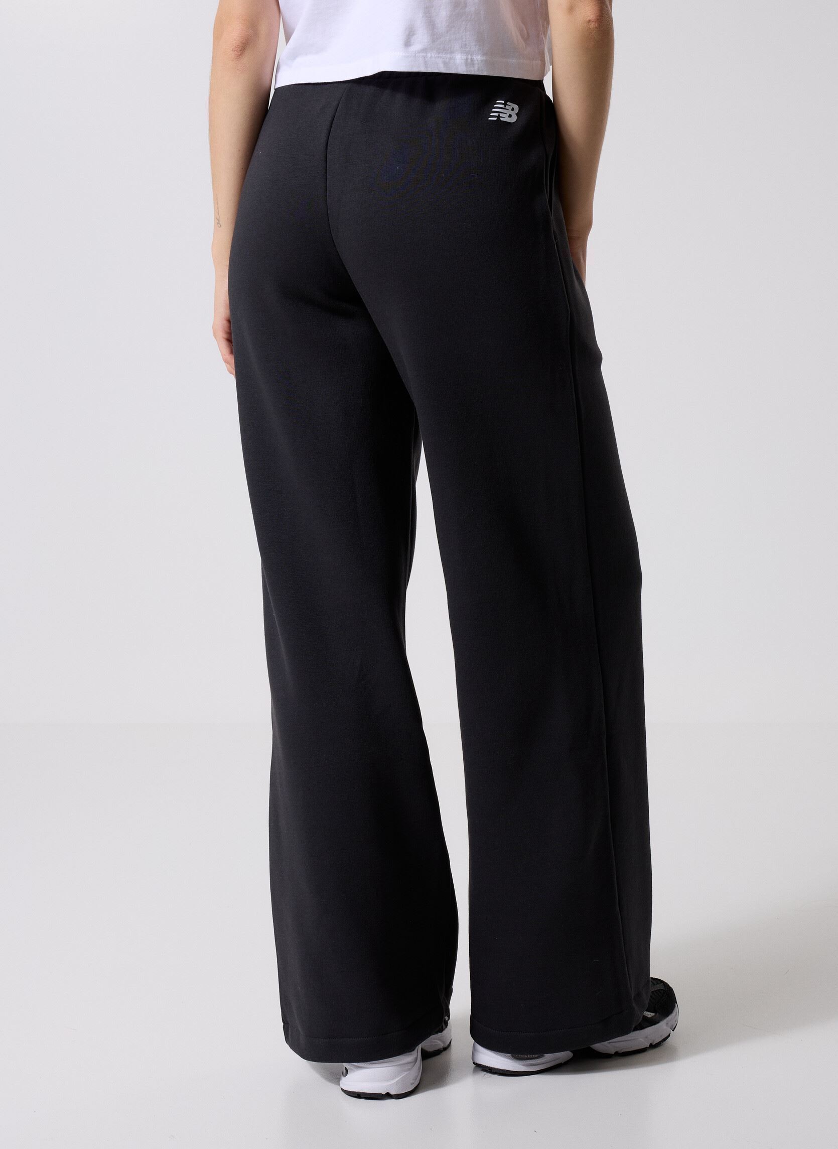 Bas de jogging Linear Heritage Fleece Wide Leg Pant femme noir New Balance Bas de jogging Linear Heritage Fleece Wide Leg Pant femme noir Black