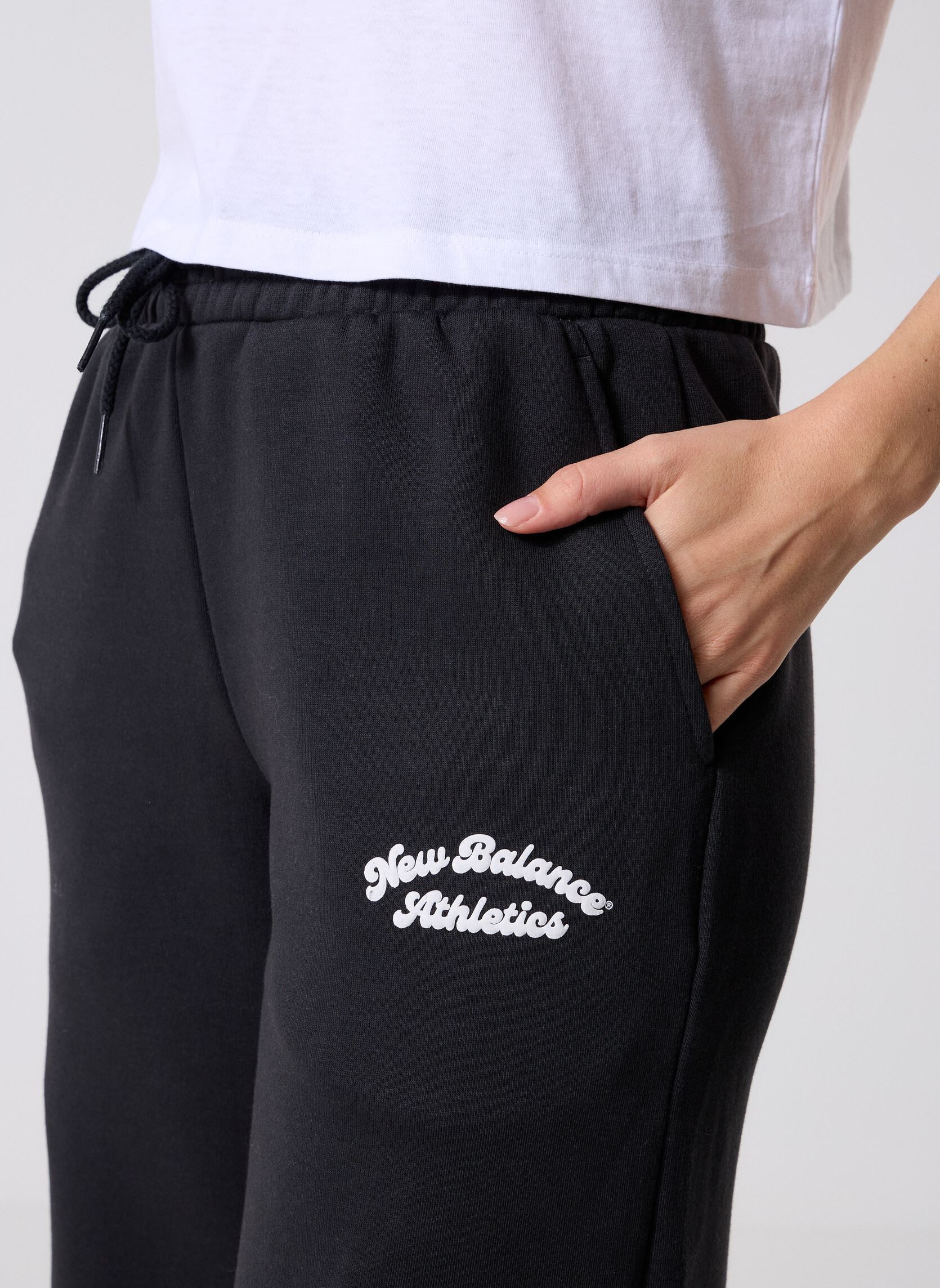 Bas de jogging Linear Heritage Fleece Wide Leg Pant femme noir New Balance Bas de jogging Linear Heritage Fleece Wide Leg Pant femme noir Black
