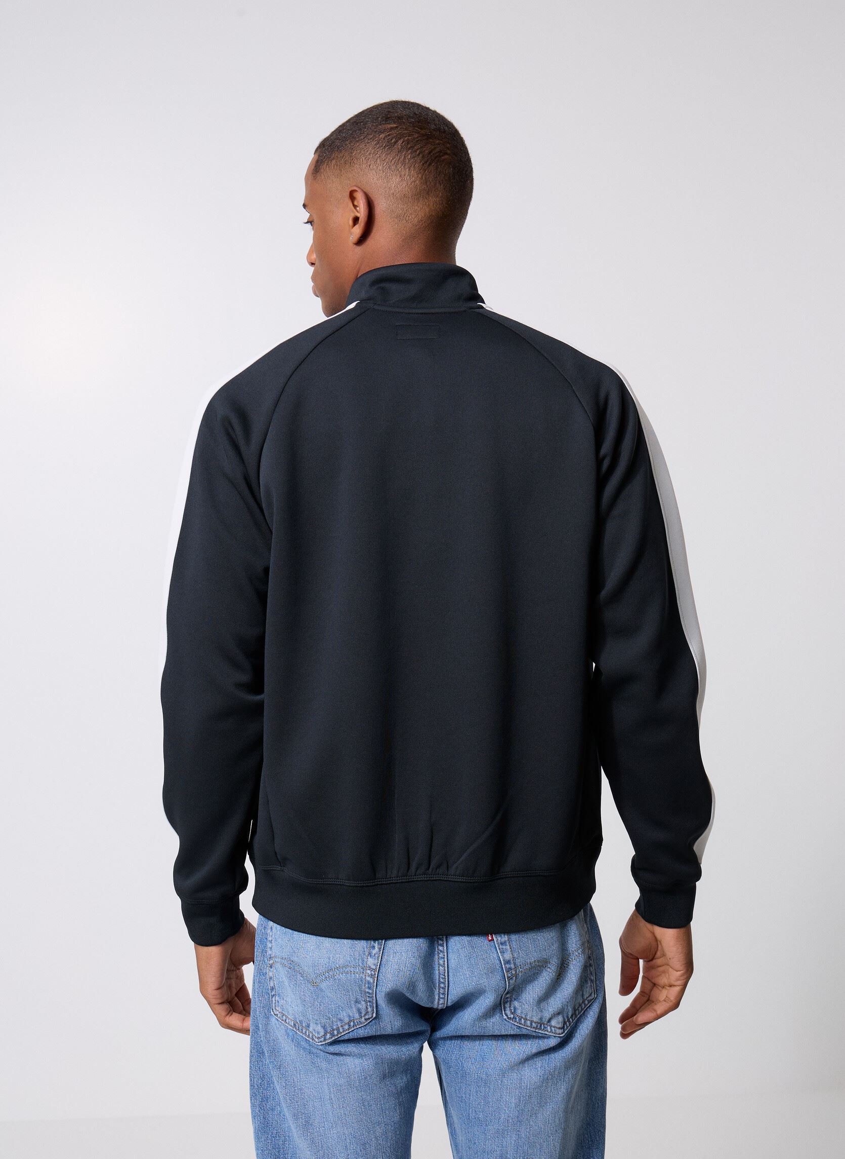 Vestes de survêtement Retro Track Jkt homme noir Converse Vestes de survêtement Retro Track Jkt homme noir Blk/Wht Black