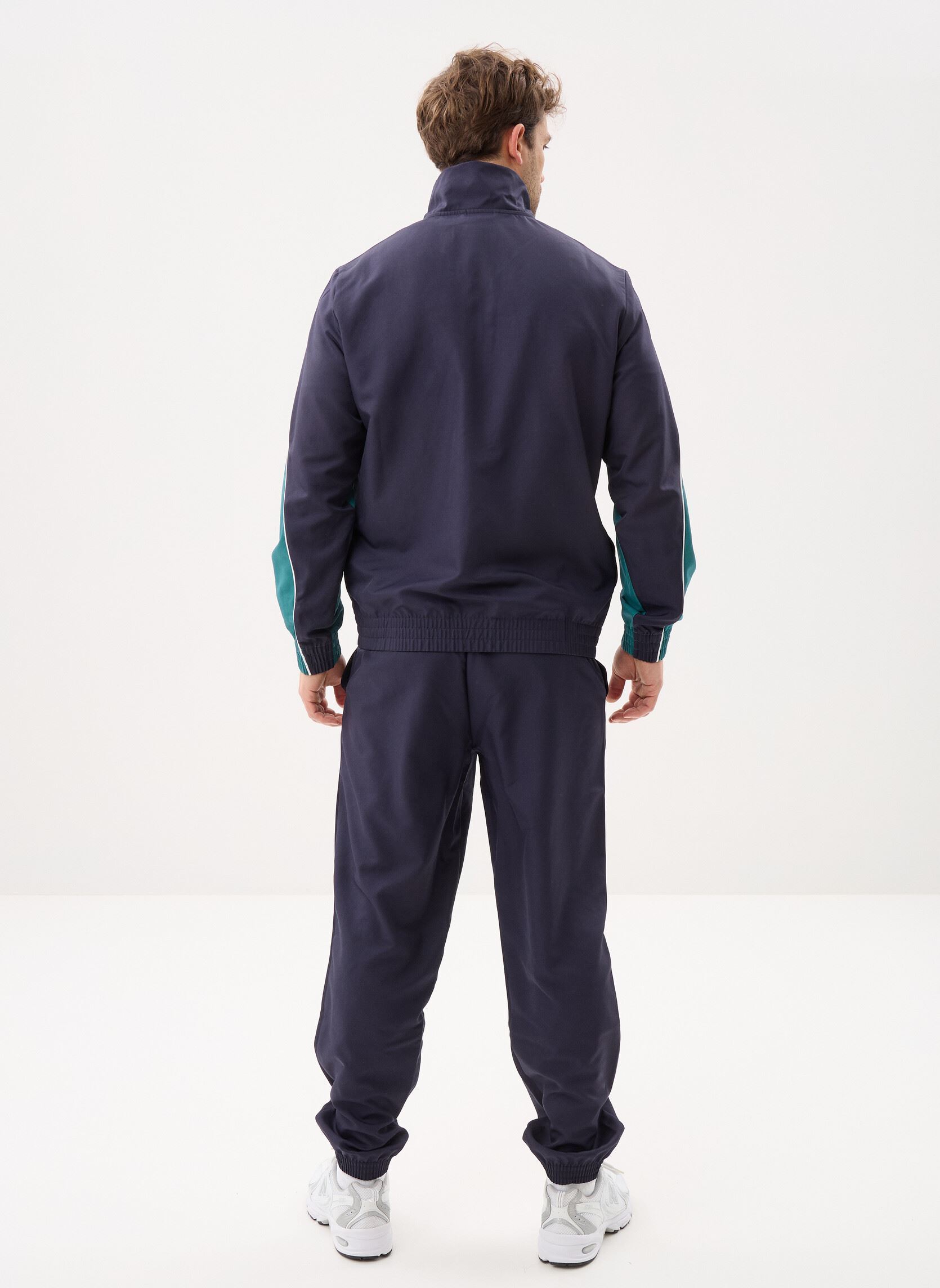 Trainingspakken Woven Colorblock Suit heren blauw Puma Trainingspakken Woven Colorblock Suit heren blauw NEW NAVY