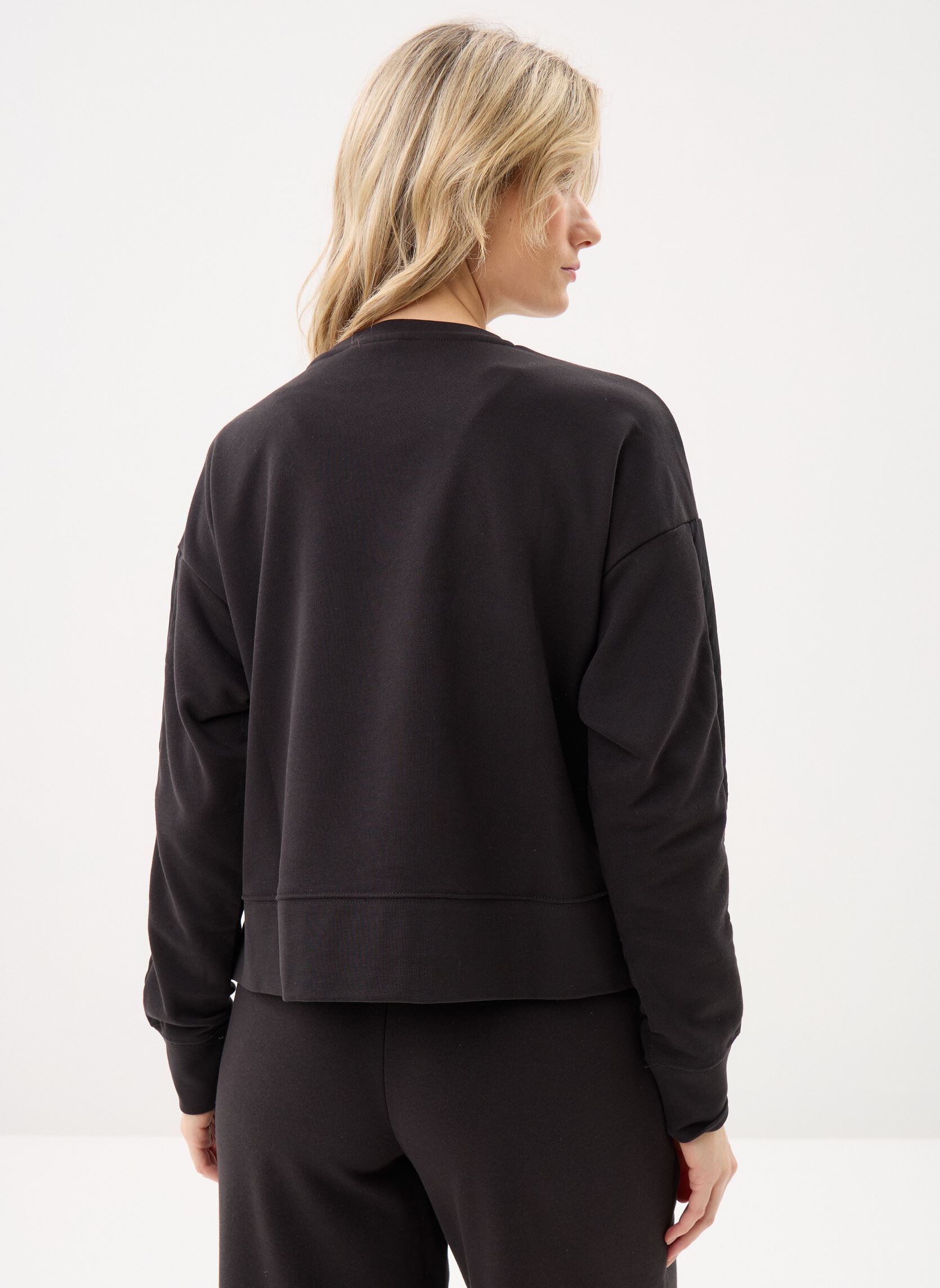 Sweatshirts HER Relaxed Crew TR femme noir Puma Sweatshirts HER Relaxed Crew TR femme noir Puma Black