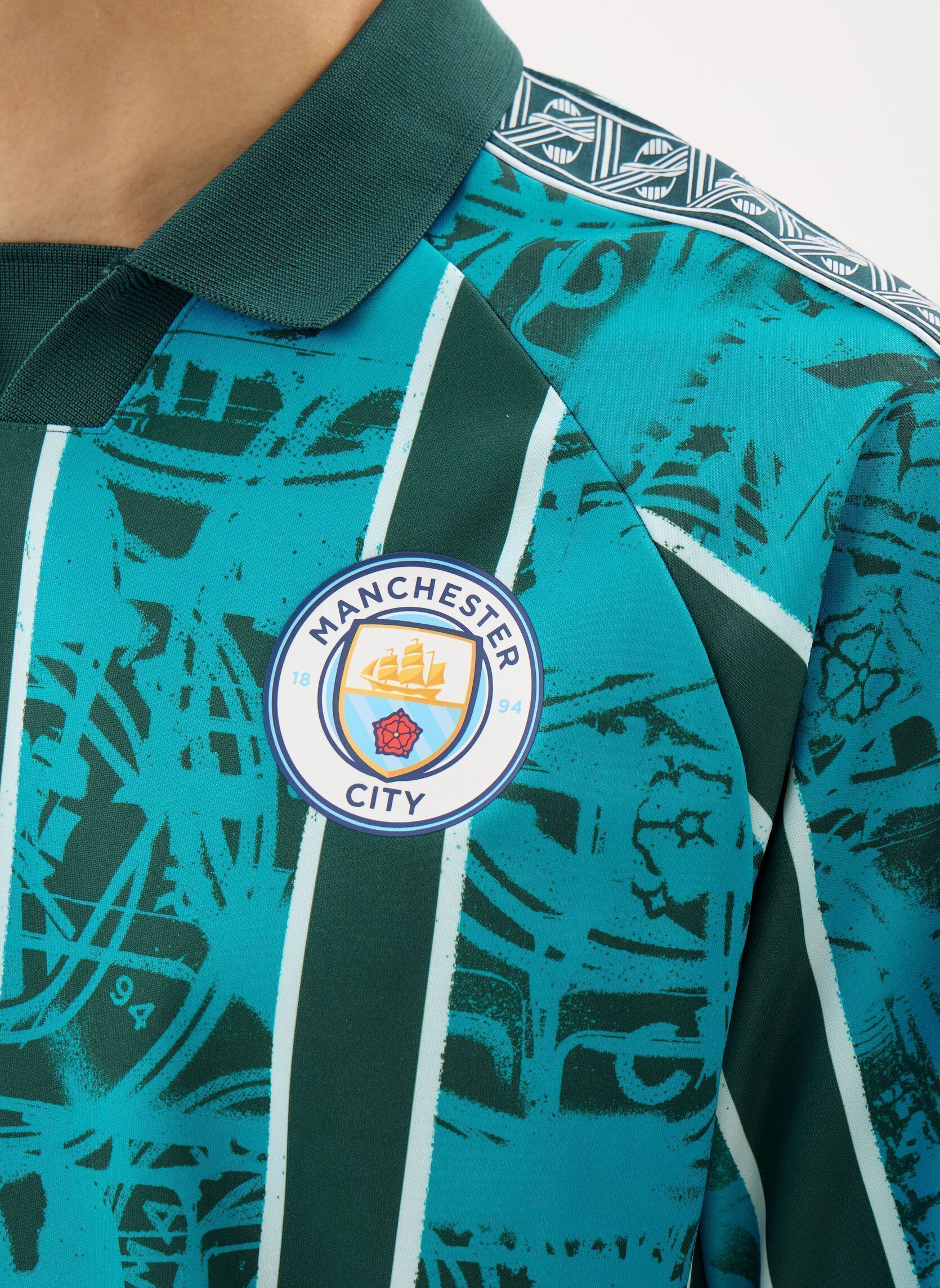 Polos MCFC KING Retro Jersey homme bleu Puma Polos MCFC KING Retro Jersey homme bleu Tropical Blue-Deep Navy