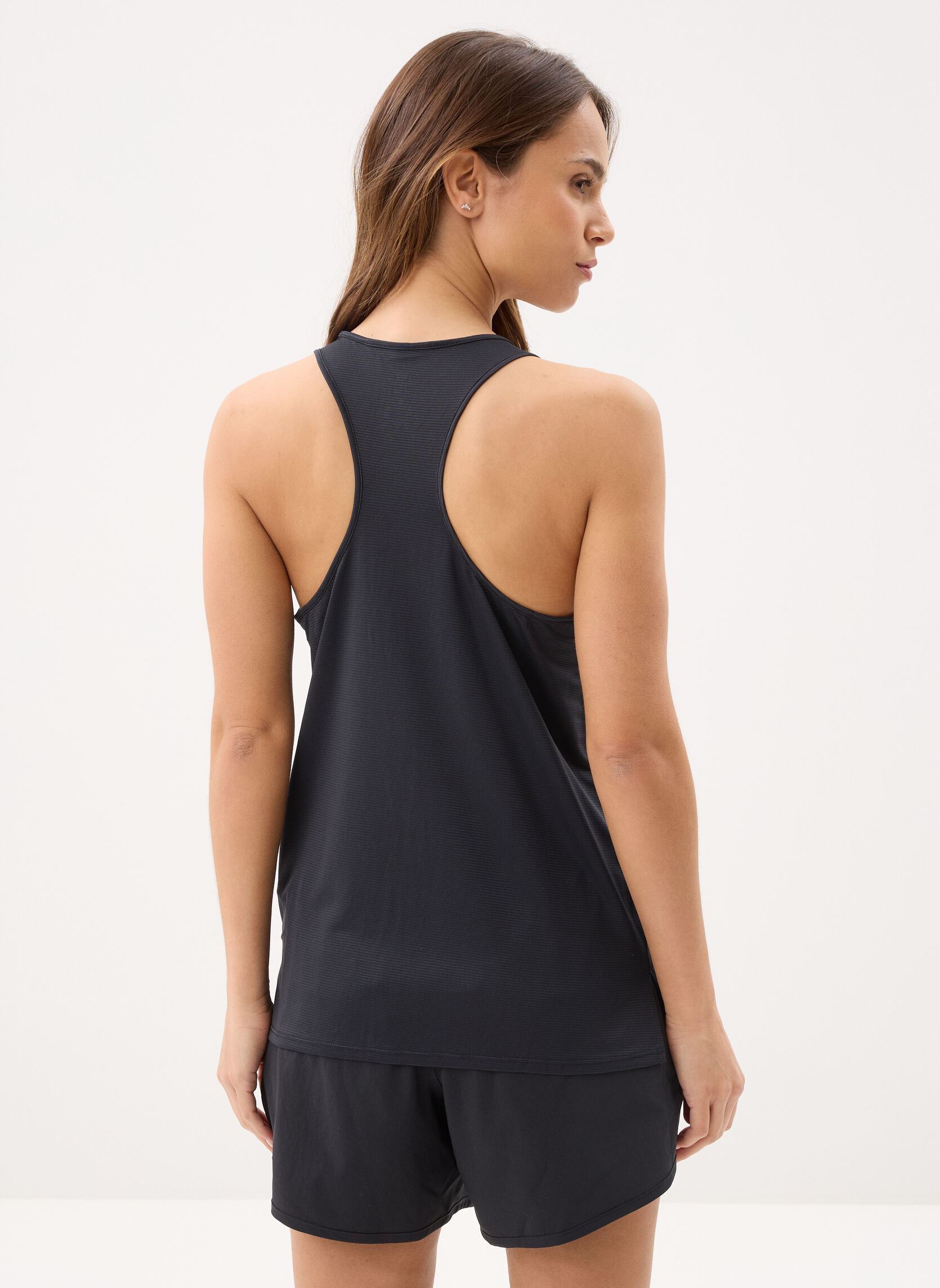 Débardeurs Sport Essential Tank femme noir New Balance Débardeurs Sport Essential Tank femme noir Black