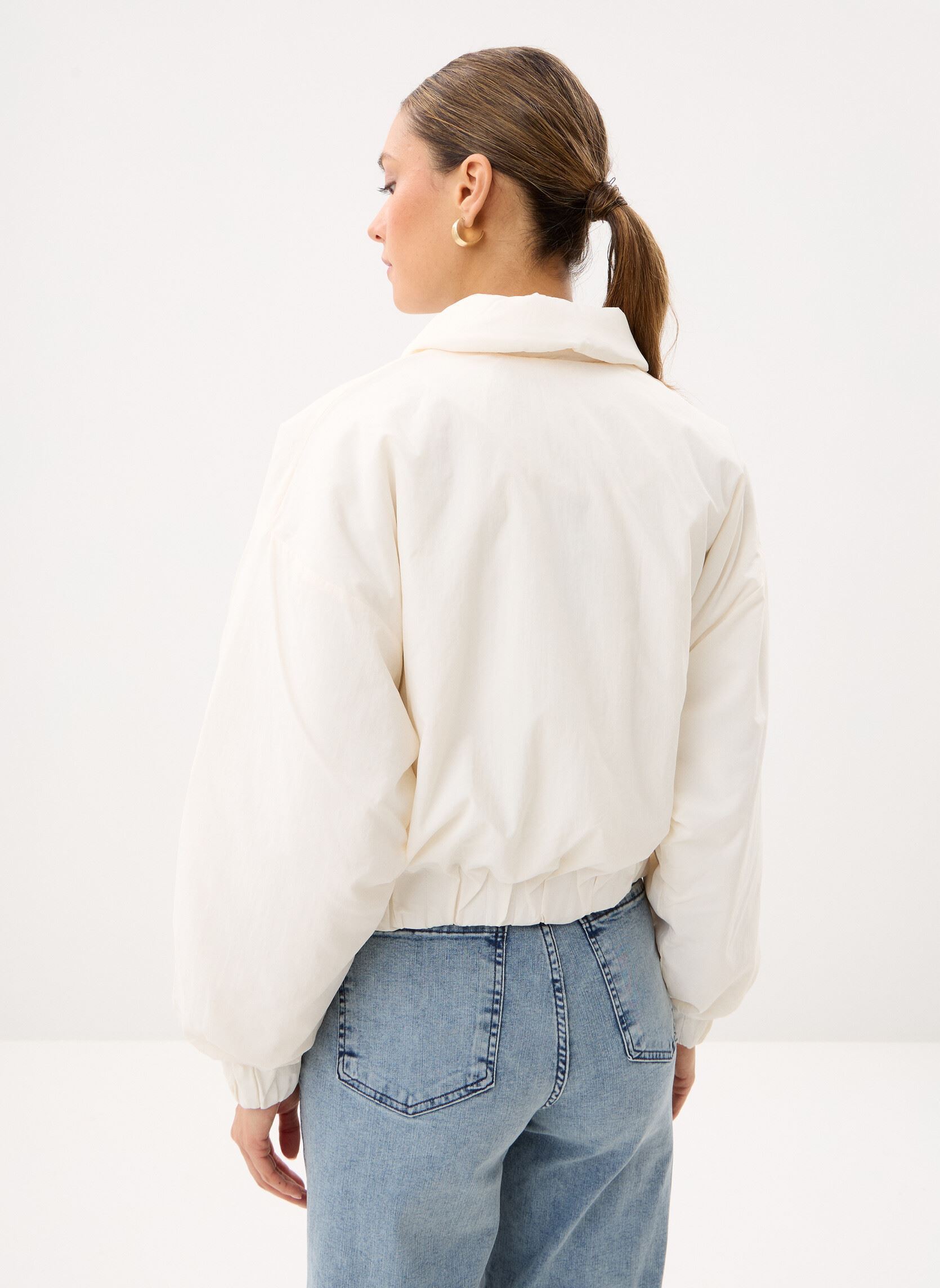 Blousons Woven Bomber Jacket femme blanc New Balance Blousons Woven Bomber Jacket femme blanc Sea salt