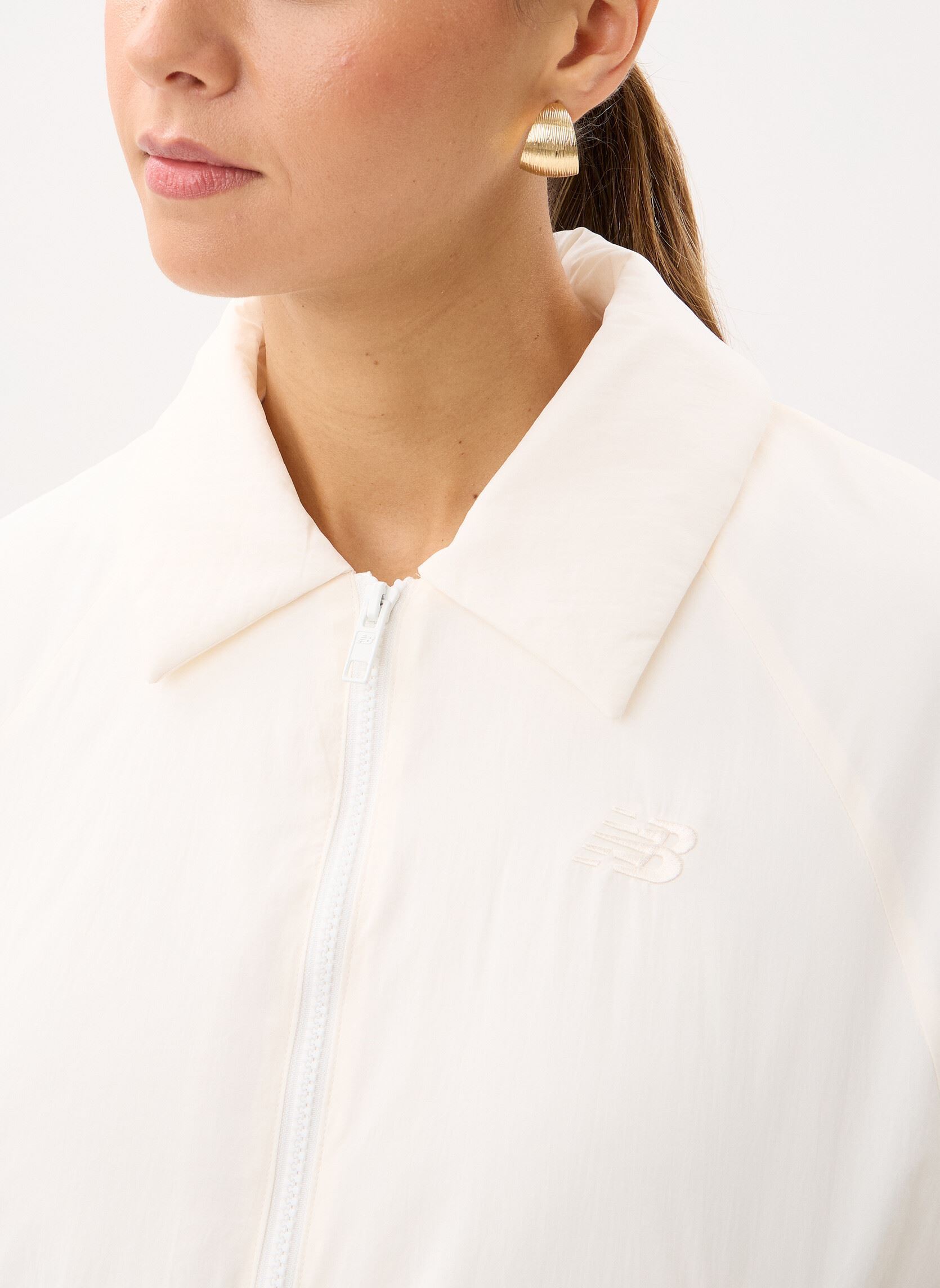 Blousons Woven Bomber Jacket femme blanc New Balance Blousons Woven Bomber Jacket femme blanc Sea salt