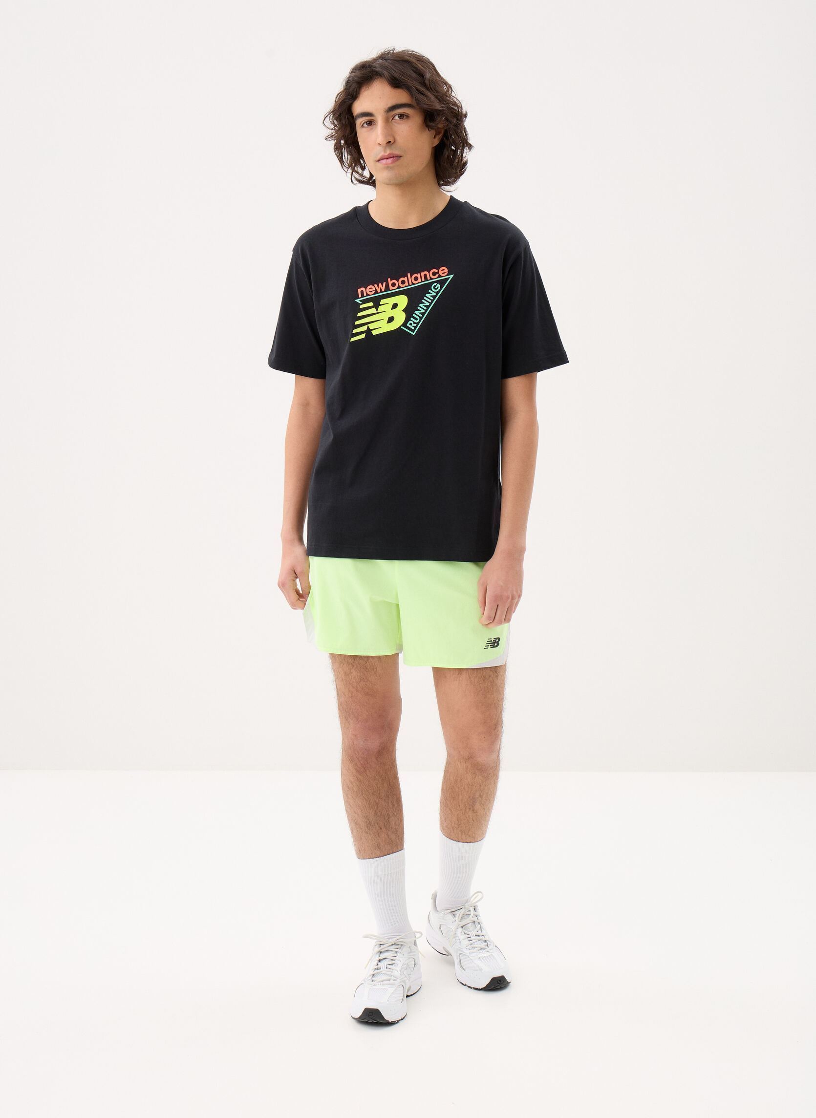 Shorts de sport RC Essential Short 5 homme jaune New Balance Shorts de sport RC Essential Short 5 homme jaune Afterglow