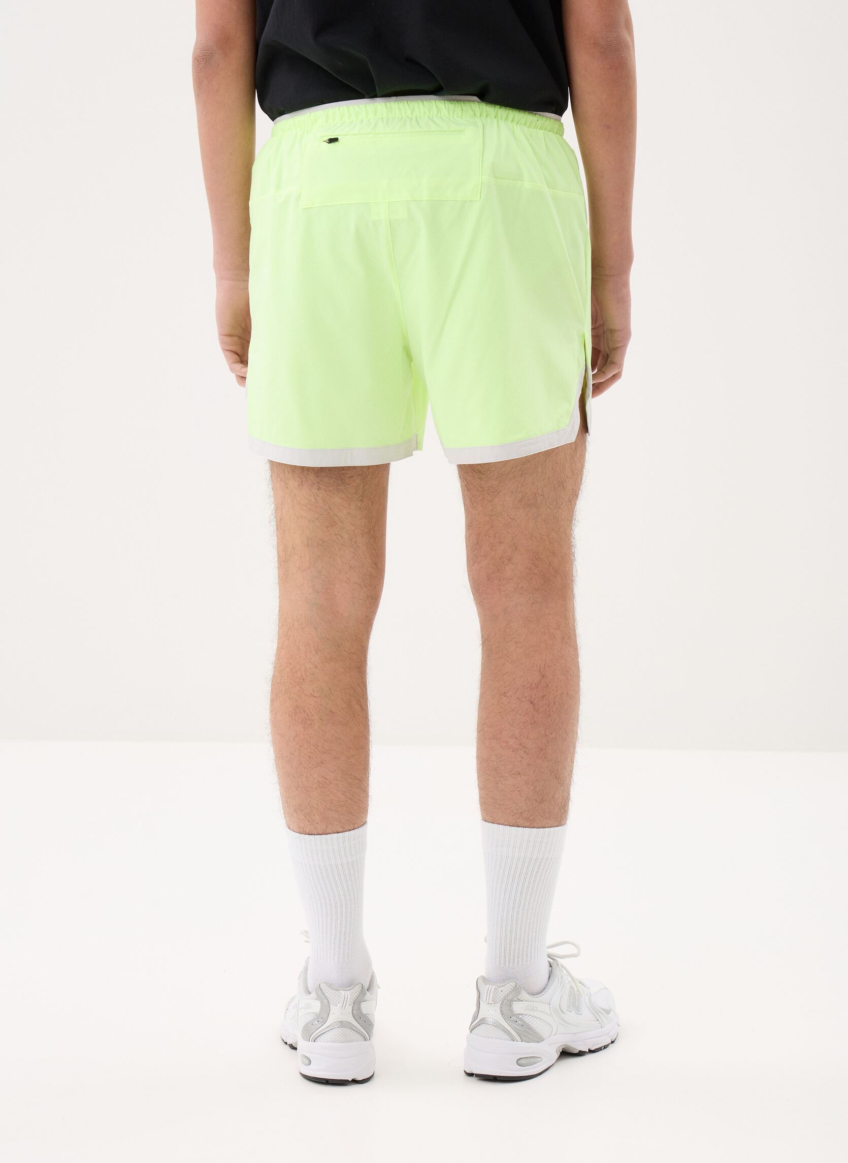 Shorts de sport RC Essential Short 5 homme jaune New Balance Shorts de sport RC Essential Short 5 homme jaune Afterglow
